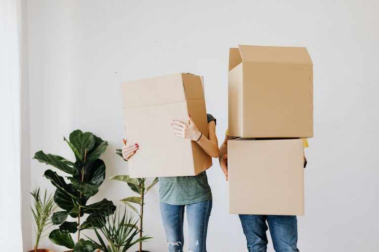 couple holding their leftover boxes