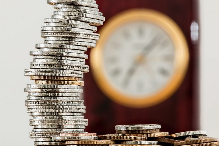 Coins and a clock on the wall