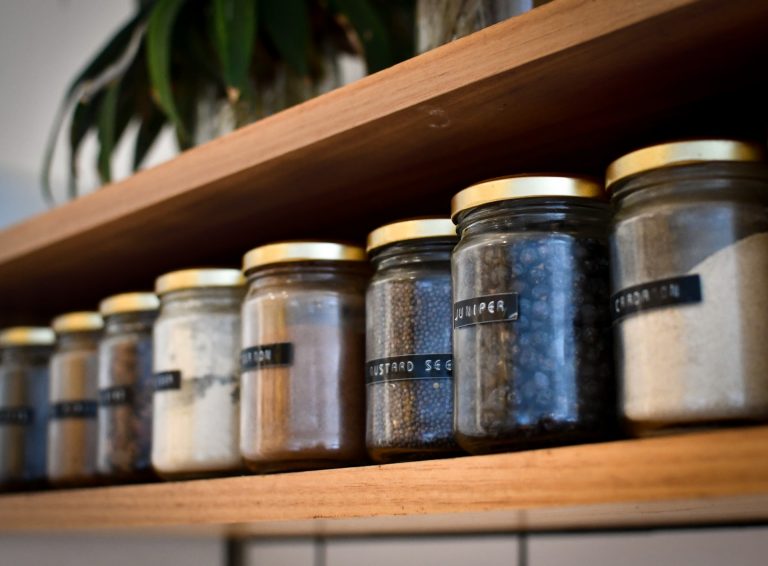 A cupboard full of various jars
