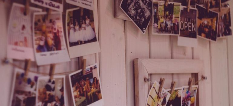 photos on a wall to make your new place feel like home after moving