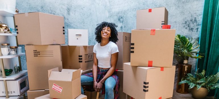 Girl surrounded by boxes 