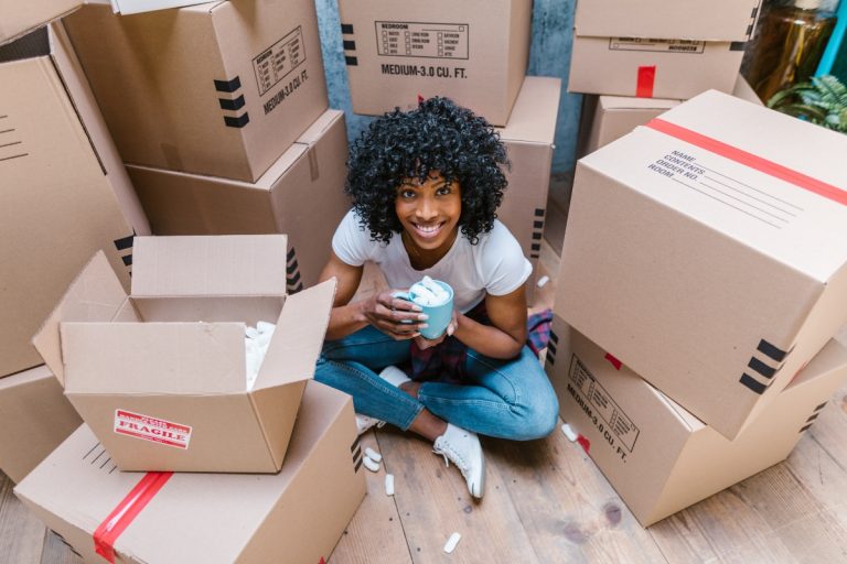 a woman thinking of how to save money on moving supplies