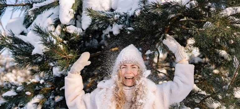 woman playing in the snow