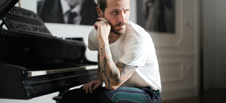 A person wondering whether is it safe to store a piano