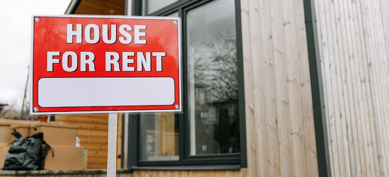 A sign indicating a house for rent