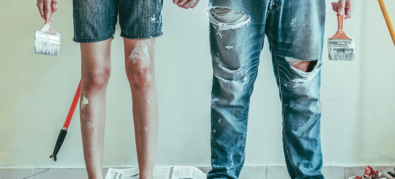 Picture of people that are painting their home 