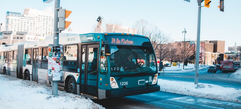 Bus on the road - in one of the places to live in when you work in Ottawa. 