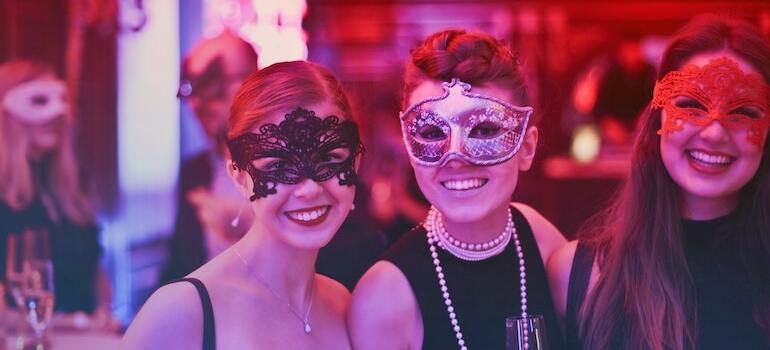 Two girls at a coustume party trying to spend Halloween in Ottawa in a fun way
