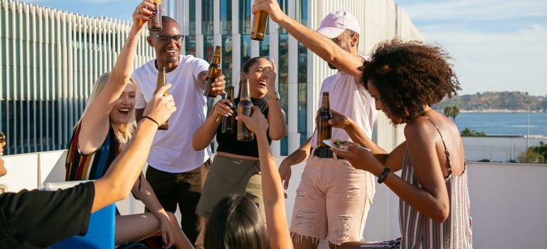 Group of friends enjoying drinks and laughing