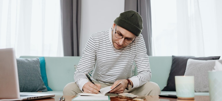 a man writing something