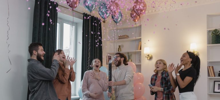 Group of friends at a gender reveal party