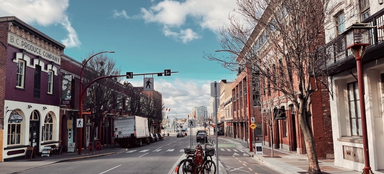 Road near brown buildings, Victoria CA which is one of the places for starting your business in Canada