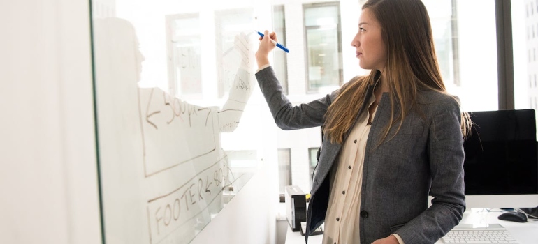 a business woman thinking about finding the best coworking places in Ottawa