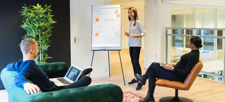 a business woman giving a presentation about the best coworking places in Ottawa