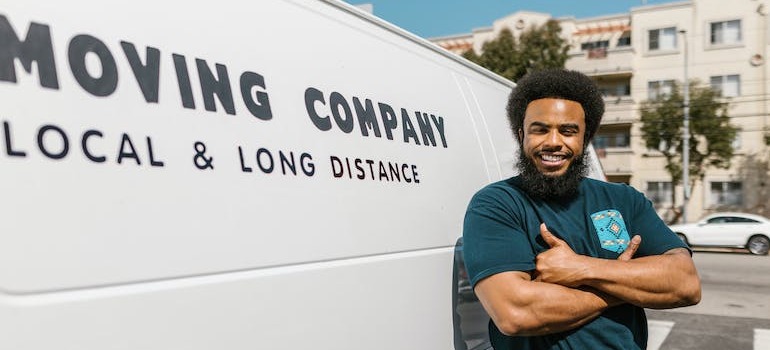 A mover in front of a moving van