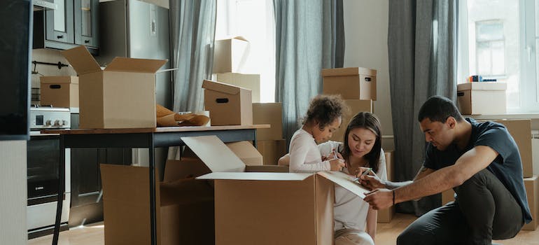 A family labeling boxes