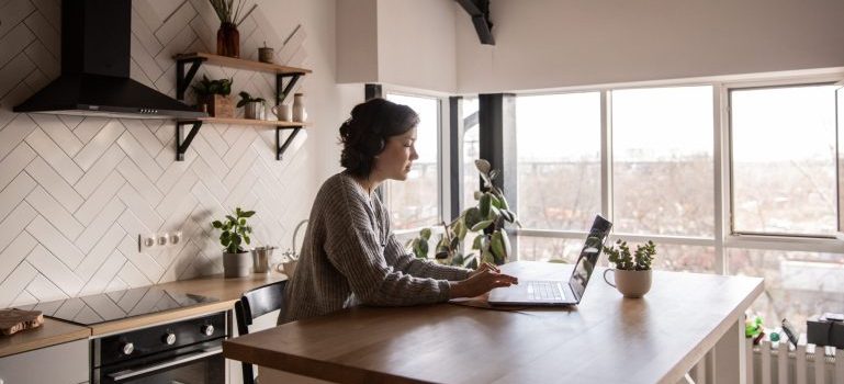 Woman in her kitchen in one of the small places near Ottawa perfect for remote workers