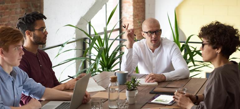 a group of people talking about the best time of year to move a business in Ottawa