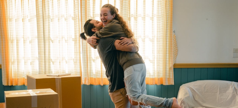 a happy couple after renting an apartment in Ottawa