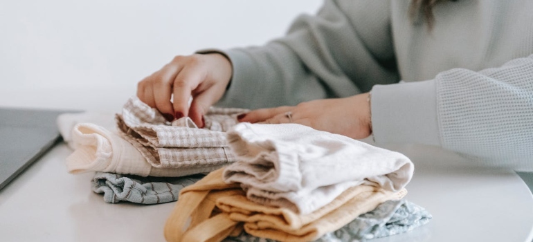 a woman decluttering clothes