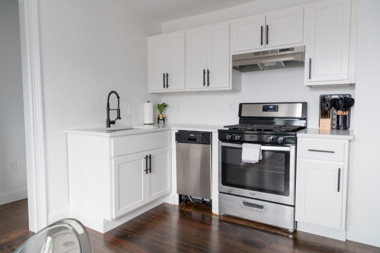 White wooden kitchen before you prepare your appliances for relocation