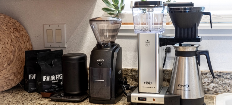 The kitchen appliances on the countertop. 