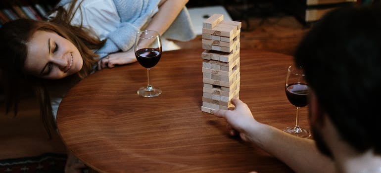 two people drinking wine