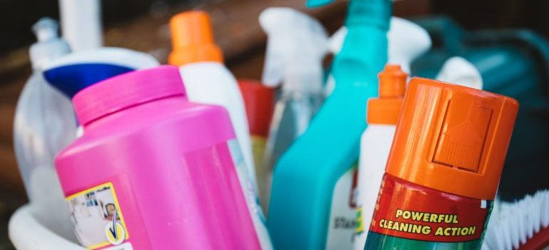 Cleaning supplies in a bucket, these are some of the most challenging items to pack for relocation