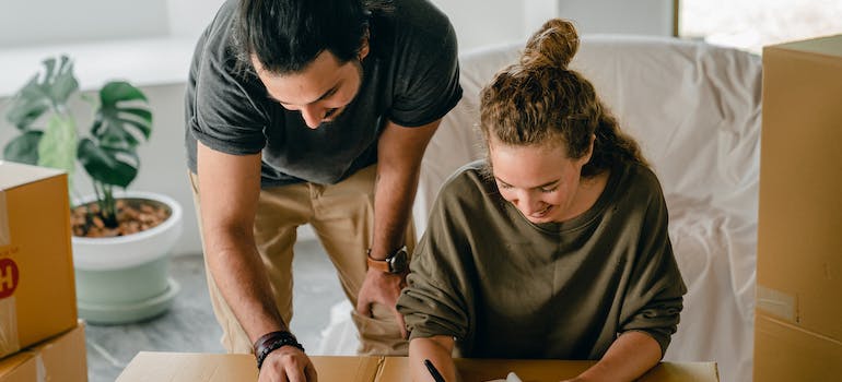 a couple trying to make an inventory before moving