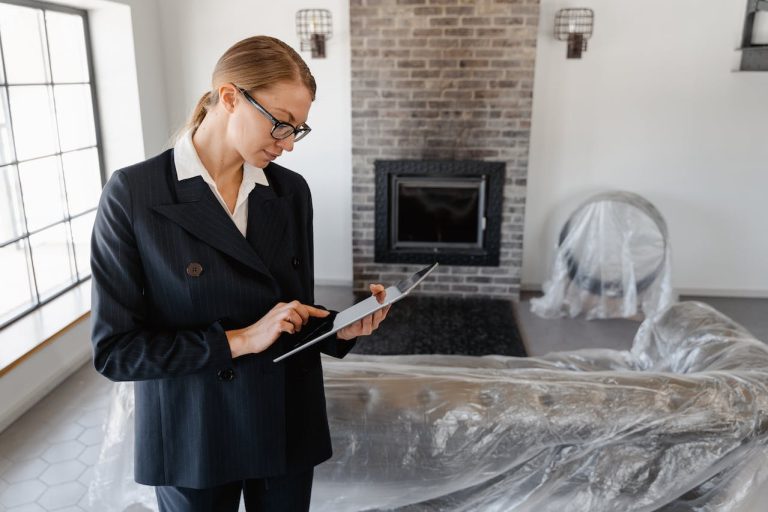 a woman in a black suit researching the real estate trends in Kanata
