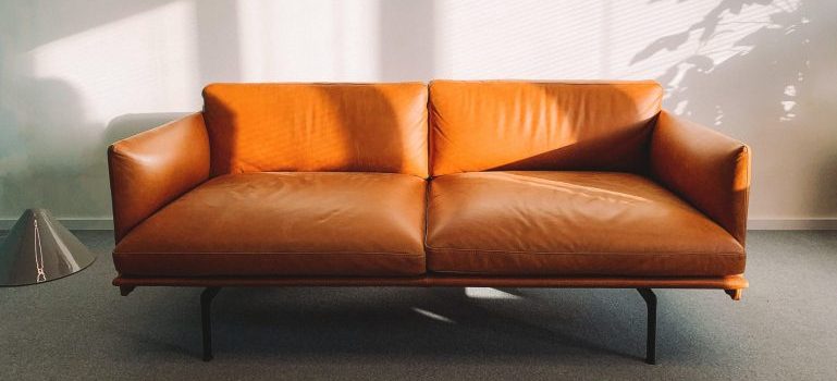Brown letter couch, an item on the list of most challenging items to pack for relocation