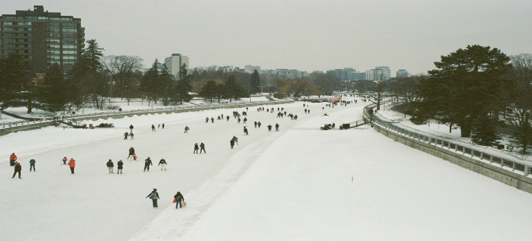 People skating on a frozen river enjoying many Ottawa must-visit holiday attractions