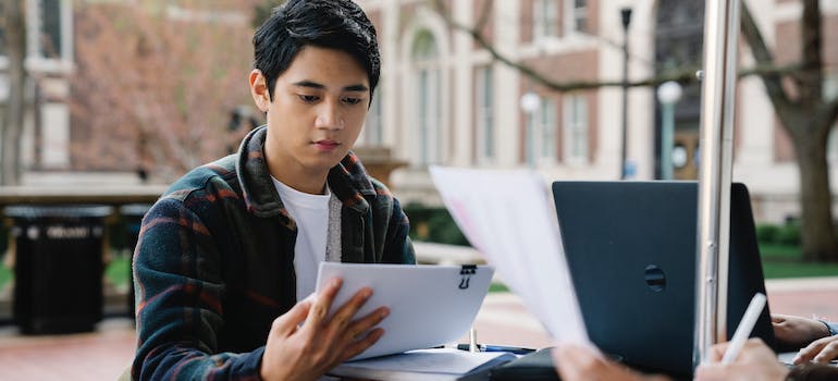 a young man reading about guide to student life in Ottawa