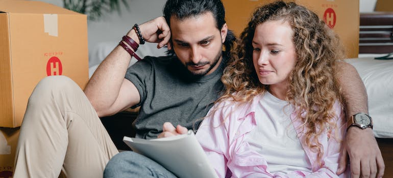 A couple writing in a notebook