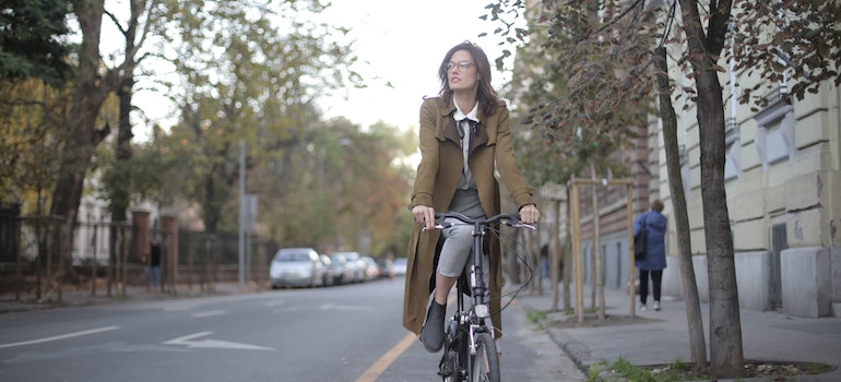 A woman riding a bicycle on safe streets of Merrickville