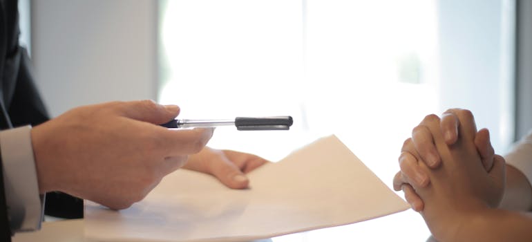 As a businessman gives a contract to a woman to sign, it serves as a reminder that like in business decisions, DIY moves aren't worth the hassle.