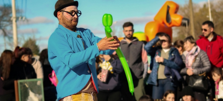 A Man Making Animal Figure from a Balloon