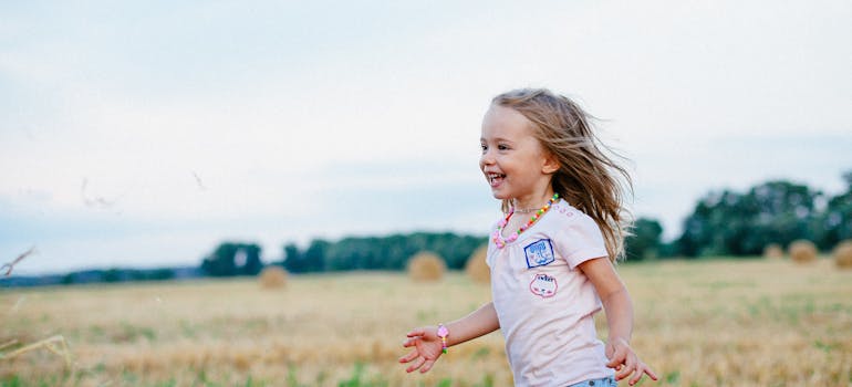 a little girl running arounf