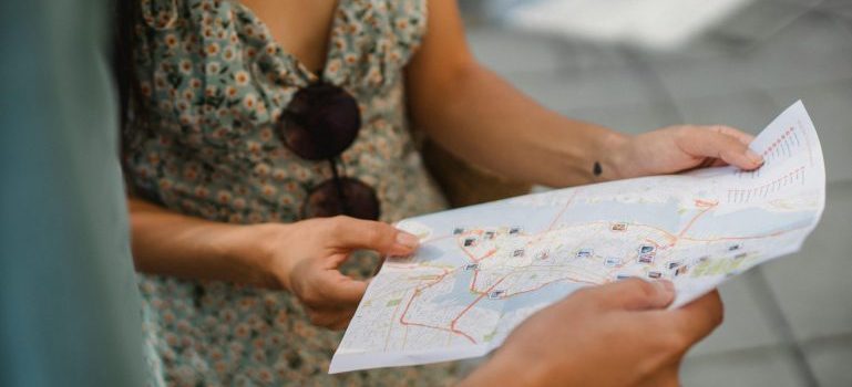 Couple's hand holding a map