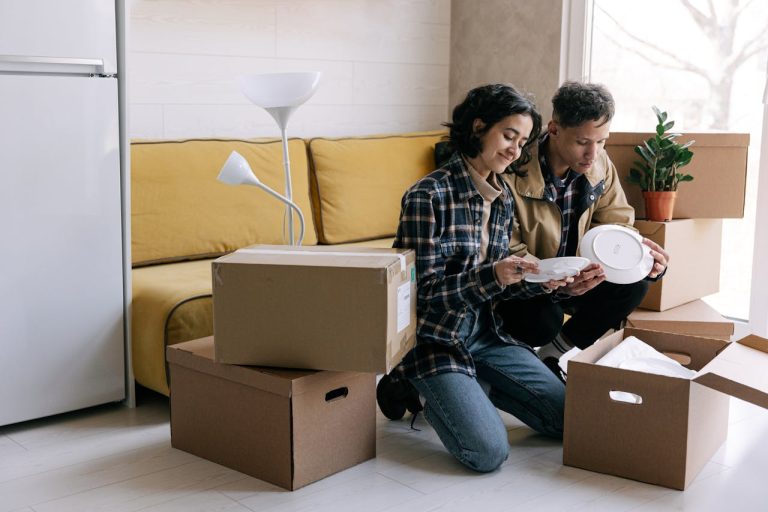a couple unpacking after moving in together in Ottawa