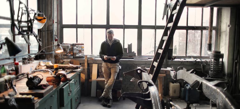 a man standing in his workshop 