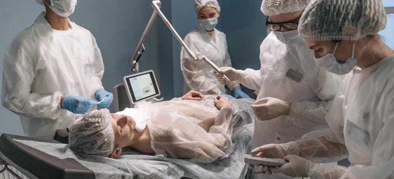 an operating room with stuff, including anesthesiologist, one of the highest paying job in Ottawa