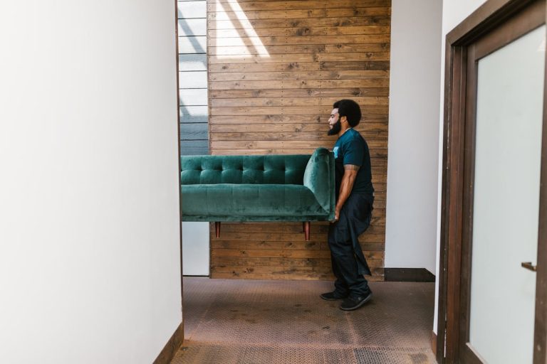 Reliable furniture movers in Ottawa carrying a couch