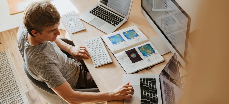 Man using computers.
