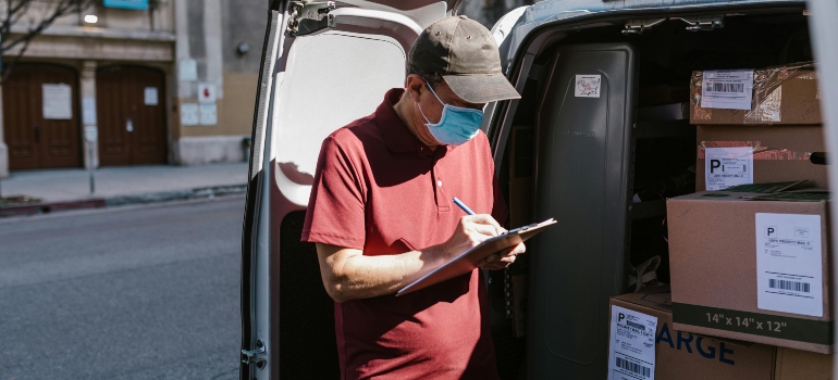 a man checking something on a list