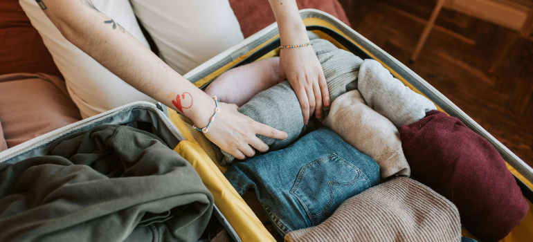 A girl packing suitcase