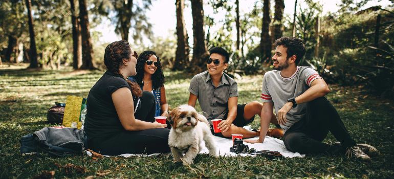 Friends with pets in park