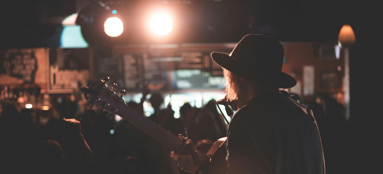 person playing guitar in one of the Ottawa's best live music venues