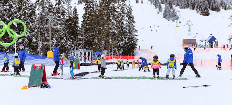 kids snowboarding during the winter in Canada