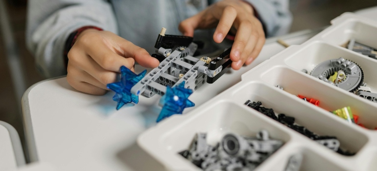 A Kid Playing with Toys and organizing small apartments